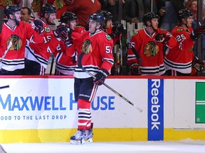 Blackhawks defenceman Trevor van Riemsdyk (57) is congratulated for scoring a goal against the Blues during the second period in Game 6 of the first round NHL playoffs series in Chicago on Saturday, April 23, 2016. (Dennis Wierzbicki/USA TODAY Sports)