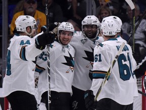Sharks defenceman Marc-Edouard Vlasic (44), left wing Matt Nieto (83), right wing Joel Ward (42) and defenceman Justin Braun (61) celebrate after a goal against the Kings during the second period in Game 5 of the first round NHL playoff series in Los Angeles on Friday, April 22, 2016. The Sharks defeated the Kings 6-3 to win the series 4-1. (Kirby Lee/USA TODAY Sports)