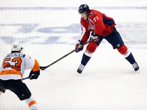 Capitals right wing T.J. Oshie (77) shoots the puck as Flyers defenceman Shayne Gostisbehere (53) defends during the third period in Game 5 of the first round NHL playoff series in Washington on Friday, April 22, 2016. (Geoff Burke/USA TODAY Sports)