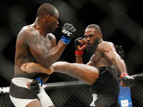 Jon Jones, right, kicks Ovince Saint Preux during an interim light heavyweight championship mixed martial arts bout at UFC 197, Saturday, April 23, 2016, in Las Vegas. (AP Photo/John Locher)