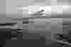 "Solar Impulse 2", a solar-powered plane piloted by Bertrand Piccard of Switzerland, flies over the Golden Gate bridge in San Francisco, California, U.S. April 23, 2016, before landing on Moffett Airfield following a 62-hour flight from Hawaii. (Jean Revillard/Solar Impulse/Handout via REUTERS)