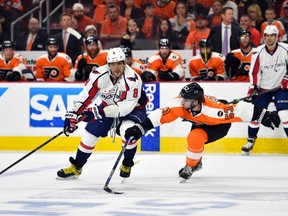Washington Capitals left wing Alex Ovechkin (8) keeps the puck from Philadelphia Flyers defenceman Shayne Gostisbehere (53) during game six of the first round of the 2016 Stanley Cup Playoffs at Wells Fargo Center April 24, 2016. (Derik Hamilton-USA TODAY Sports)