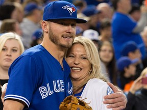 Jays’ Josh Donaldson hugs his mom, Lisa French, who was on hand on Sunday to throw out the ceremonial first pitch. (CRAIG ROBERTSON/TORONTO SUN)
