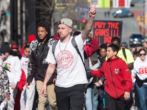 Hundreds of people take part in an anti-violence march through downtown Halifax on Sunday, April 24, 2016. The rally was in reaction to an unprecedented three shooting deaths in the city last week. THE CANADIAN PRESS/Darren Calabrese