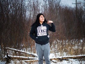 Rebecca Hookimaw, 16, poses for a photograph in the northern Ontario First Nations reserve in Attawapiskat, Ont., on Thursday, April 21, 2016. Hookimaw began drinking and taking pills and tried to commit suicide before and after the suicide of her sister Sheridan Hookimaw who was 13-years-old. THE CANADIAN PRESS/Nathan Denette