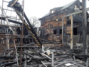 A condo block under construction at Maryland and Westminster in Winnipeg, Man. is seen Sunday April 24, 2016 after fire ripped through it, along with two adjacent homes, the previous day. (Brian Donogh/Winnipeg Sun/Postmedia Network)