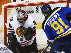 Chicago Blackhawks goalie Corey Crawford makes a save on a shot by St. Louis Blues right wing Vladimir Tarasenko during the second overtime period in game five of the first round of the 2016 Stanley Cup Playoffs at Scottrade Center. The Blackhawks won the game 4-3 in double overtime. (Billy Hurst-USA TODAY Sports)