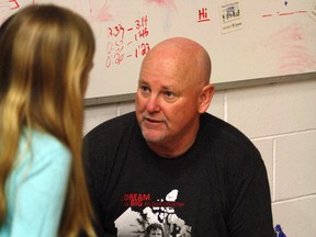 Ben Leeson/Sudbury Star
Fred Fox, brother of Terry Fox, signs autographs for students at St. James Catholic Elementary School in Lively on Friday.