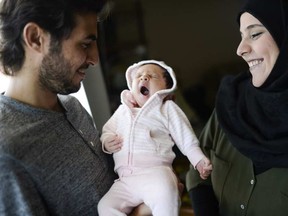 Ebrahim Alahmad and his wife, Amina Mohamad, with their daughter, Marya, who is likely the first baby to be born in Ottawa among the 1,500 Syrian refugees who have been arriving here since late in 2015. JAMES PARK / .