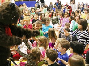 Millie the muskrat greets students at Churchill Public School during a presentation on the dangers of fast-flowing water on Thursday. (John Lappa/Sudbury Star)