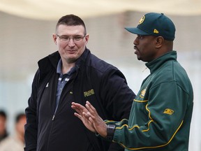 Chris Morris, left, shown with Eskimos GM Ed Hervey, has brought the U of A Golden Bears to the point where there's growing consensus the team will be a contender next season. (Ian Kucerk)