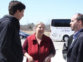 Councillor Richard Allen, left, Kathie Groenewegen, owner operator of  Limestone Organic Creamery, and Kingston Mayor Bryan Paterson talk during a tour of local businesses and farms in Kingston and South Frontenac on Saturday. (Steph Crosier/The Whig-Standard)