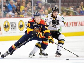 Travis Dermott of the Erie Otters is challenged by London Knights co-captain Mitchell Marner during Game 2 of the OHL Western Conference championship series Sunday in Erie, Pa. The Knights won 6-1 to take a 2-0 lead in the best-of-seven series. (ANDY COLWELL/Special to Postmedia News)