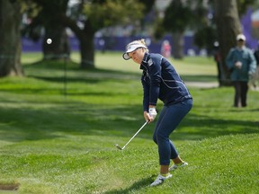 Brooke Henderson, of Canada, chips the ball onto the first green of the Lake Merced Golf Club during the final round of the Swinging Skirts LPGA Classic golf tournament Sunday, April 24, 2016, in Daly City, Calif. (AP Photo/Eric Risberg)
