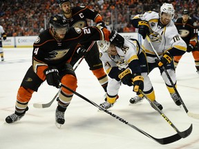 Nashville Predators defenseman Roman Josi battles with Anaheim Ducks defenseman Simon Despres for the puck during the third period in game five of the first round of the 2016 Stanley Cup Playoffs at Honda Center. (Kelvin Kuo/USA TODAY Sports)