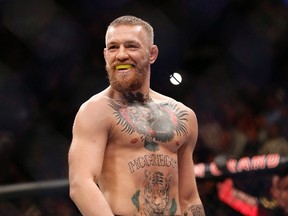 Conor McGregor awaits the start of his UFC 196 welterweight mixed martial arts match against Nate Diaz, Saturday, March 5, 2016, in Las Vegas. McGregor says (in all caps) that he's not retired from fighting. The mixed martial arts fighter posted on Facebook Thursday that he'd like to focus on training more and less on gruelling promotional demands that come with being a pay-per-view star. (THE CANADIAN PRESS/AP/Eric Jamison)