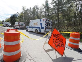 Law enforcement closed down Union Hill Road in Pike County, Ohio, while they investigated a shooting with multiple fatalities on Friday, April 22, 2016. (Chris Russell/The Columbus Dispatch via AP)