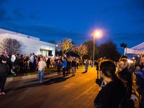 Fans pay tribute to Prince outside his Paisley Park estate in Chanhassen, Minnesota, following his sudden death. (WENN.COM)