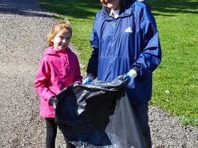 Lucy Radke, of Mitchell, invited her granddaughter Grace down from Toronto to help pick up garbage in the Stacey Brothers Park in Mitchell during the annual West Perth Spring Clean-up last Saturday, April 23. The annual clean-up was successful as almost 100 people across the municipality officially helped out in one capacity or another under near ideal weather conditions. GALEN SIMMONS MITCHELL ADVOCATE