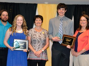 Flanked by the family of the late Stephen Elliott, Maggie McDonnell (third from left) and Connor Gettler (third from right) were chosen as the Mitchell Minor Sports female and male athletes of the year last Friday, April 22. Presenting the newly-named Stephen Elliott memorial award were Vicki Smith (left), Craig Elliott, Susie Elliott (middle), Jenny Crown and Dave Elliott. ANDY BADER MITCHELL ADVOCATE