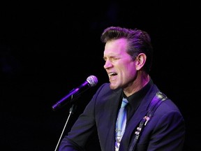 Chris Isaak performs last September in Nashville. Isaak has been booked to play the Burton Cummings Theatre on Aug. 27. (Photo by Wade Payne/Invision/AP)