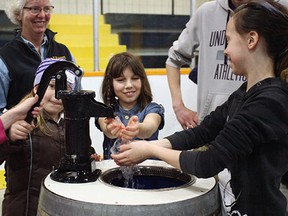 Alicia Paulen (center) and Kylie Jones (right), both Grade 4 students from Upper Thames Elementary School, and their classmates travelled to the Seaforth and District Community Centre for the Huron-Perth Agriculture and Water Festival April 12-13, where they learned about the importance of water conservation in agriculture.  SHAUN GREGORY POSTMEDIA NETWORK