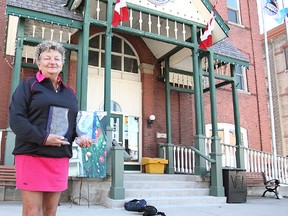 Huron East’s economic development officer, Jan Hawley holds the two awards that were won this month in London Ont. (Shaun Gregory/Huron Expositor)