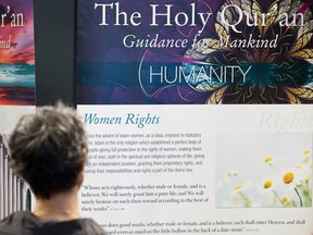 In this file photo, a visitor checks out information panels at the Ahmadiyya Students Association booth in Edmonton, Alta. The association is holding an open house on Mother Mary in Islam, Saturday, noon to 4 p.m., at the Sarnia Public Library. (File photo)