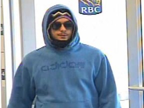 Security camera image of a man sought in a series of bank robberies in the GTA.