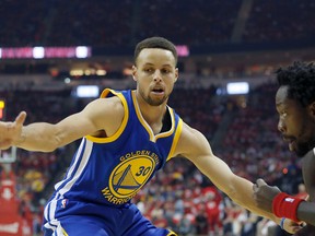 Golden State Warriors guard Stephen Curry defends Houston Rockets guard Patrick Beverley during the NBA playoffs Sunday at the Toyota Center in Houston. (Thomas B. Shea/USA TODAY Sports)