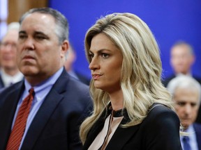 Sportscaster and television host Erin Andrews, right, stands with attorney Scott Carr, left, as they wait for the jury to enter the courtroom before closing arguments Friday, March 4, 2016, in Nashville, Tenn. (AP Photo/Mark Humphrey, Pool)