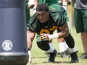 Defensive lineman Sam Montgomery (93) sets up to run through drills during the mini-camp at Historic Dodgertown in Vero Beach on Sunday, April 17, 2016. (Hobie Hiler photo)