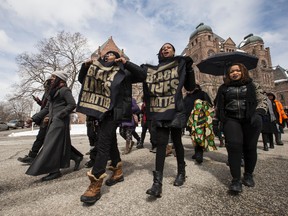 Protesters with Black Lives Matter Toronto march to Queen's Park from Toronto Police headquarters on Monday, April 4, 2016. (Craig Robertson/Toronto Sun)