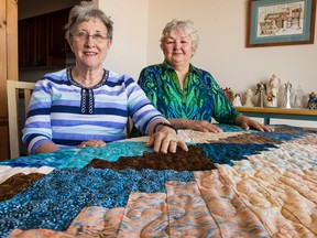 Betty Giffin, left, and Blanche Dunn are, respectively, founder and president of Victoria's Quilts Canada, a not-for-profit charity that provides hand-made quilts for cancer patients. BRUCE DEACHMAN/POSTMEDIA