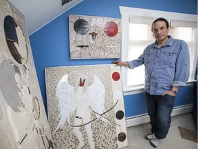 Artist Wayne Ashley is seen with his artwork at his home in Edmonton, Alta., on Monday, March 30, 2015. Ashley has made several art pieces referencing recent murders and missing and murdered Aboriginal women. (Ian Kucerak photo)