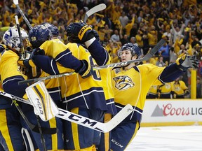 Predators centre Filip Forsberg (right) joins the celebration after defenceman Shea Weber (6) scored an empty-net goal against the Ducks in the final seconds of the third period to give the Predators a 3-1 victory in Game 6 of of their first-round NHL playoff series in Nashville on Monday, April 25, 2016. (Mark Humphrey/AP Photo)