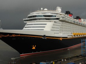 The "Disney Fantasy" cruise ship leaves the German shipyard Meyer on the river Ems in Papenburg, northern Germany, on Jan. 20, 2012. U.S. Marshal Amos Rojas Jr. said in a news release that last Thursday, the Disney Fantasy cruise ship found three fugitives clinging to a capsized boat. (REUTERS/Fabian Bimmer)