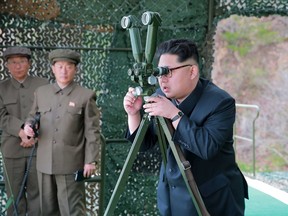 North Korean leader Kim Jong Un guides on the spot the underwater test-fire of strategic submarine ballistic missile in this undated photo released by North Korea's Korean Central News Agency (KCNA) in Pyongyang on April 24, 2016. (KCNA/via REUTERS)