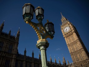 An exterior view shows the Houses of Parliament and Elizabeth Tower, which houses the Big Ben bell in London, Tuesday, April 26, 2016. Officials say the chimes of Britain's Big Ben bell will fall silent for several months during a three-year restoration of Parliament's crumbling clock tower. (AP Photo/Matt Dunham)