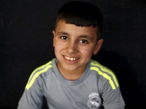 Freed Yazidi boy Murad, 9, who was trained by Islamic State, smiles at a refugee camp near the northern Iraqi city of Duhok, on April 19, 2016. The stories of boys from the minority Yazidi community now living in a refugee camp near the northern Iraqi city of Duhok appear to show efforts by Islamic State to create a new generation of fighters loyal to the group's ideology and inured to its extreme violence. The training often leaves them scarred, even after returning home. (REUTERS/Ahmed Jadallah)