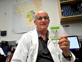 Western University researcher Gregor Reid holds a packet of probiotic freeze-dried bacteria in his lab in London Ont. April 21, 2016. Reid is part of an international partnership hoping to manufacture 200,000 packets for malnourished Africans in Tanzania, Kenya and Uganda who could use them to make their own yogurt. CHRIS MONTANINI\LONDONER\POSTMEDIA NETWORK