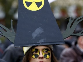 A woman with radiation signs painted on her face takes part in a rally to mark the 30th anniversary of the Chornobyl nuclear disaster in Minsk, Belarus, April 26, 2016. REUTERS/Vasily Fedosenko