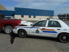 No one was hurt when a man backed a truck into an RCMP cruiser in Grande Prairie on April 24. A man is facing multiple charges, including assault with a weapon. SUPPLIED