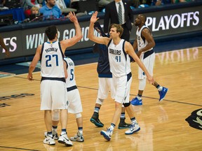Dallas Mavericks center Zaza Pachulia and forward Dirk Nowitzki celebrate making a basket against the Oklahoma City Thunder in game three of the first round of the NBA Playoffs at American Airlines Center. (Jerome Miron/USA TODAY Sports)