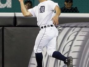 Detroit Tigers center fielder Tyler Collins catches a fly ball hit by Oakland Athletics' Chris Coghlan during the sixth inning of a baseball game, Monday, April 25, 2016 in Detroit. (AP Photo/Carlos Osorio)