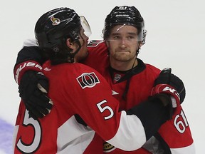 Ottawa Senators' Mark Stone and Cody Ceci look dejected after losing to the Montreal Canadiens at the Canadian Tire Centre in Ottawa on April 26, 2015. (Tony Caldwell/Postmedia Network)