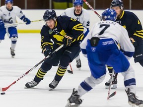 Early in the season, before the Keyano Huskies launched their march to a third-place regular-season finish and a bronze medal in provincial playoffs, they staged some close and interesting games with all rivals, including the ultimately-unbeaten NAIT Ooks. Here, first-year defender Owen Solecki (7), a product of Burns Lake, B.C., competes with Billy Gaston (12) and Connor Hoekstra (4). The decision to discontinue the Huskies’ program for economic reasons came at the end of their most successful season. (Supplied)