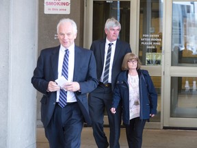 Scott and Jackie Fraser leave the court house with brother-in-law John Southcott, left, following the sentencing of James McCullough, the man convicted of killing and dismembering their son Alex Fraser, in London, Ont. on Tuesday April 26, 2016. McCullough was sentenced to life in prison with no parole for 25 years, and four years concurrently for committing an indignity to a body.  (CRAIG GLOVER, The London Free Press)