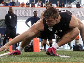 Virginia's Trent Corney, a Brockville native, reaches the line during a shuttle run during NFL pro day March 15 at the university in Charlottesville, Va. (Andrew Shurtleff/The Daily Progress via AP)