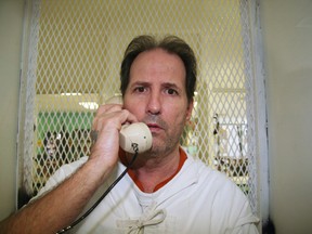 In this Aug. 13, 2014 file photo, inmate Max Soffar speaks from a visiting cage at death row at the Texas Department of Criminal Justice Polunsky Unit near Livingston. Soffar who was convicted of a robbery shooting in Houston in 1980 where three people were killed and a fourth seriously hurt, has died of natural causes. (AP Photo/Michael Graczyk, File)